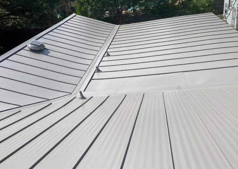 Solar attic fan installed on a metal roof for Roof Ventilation in Annapolis